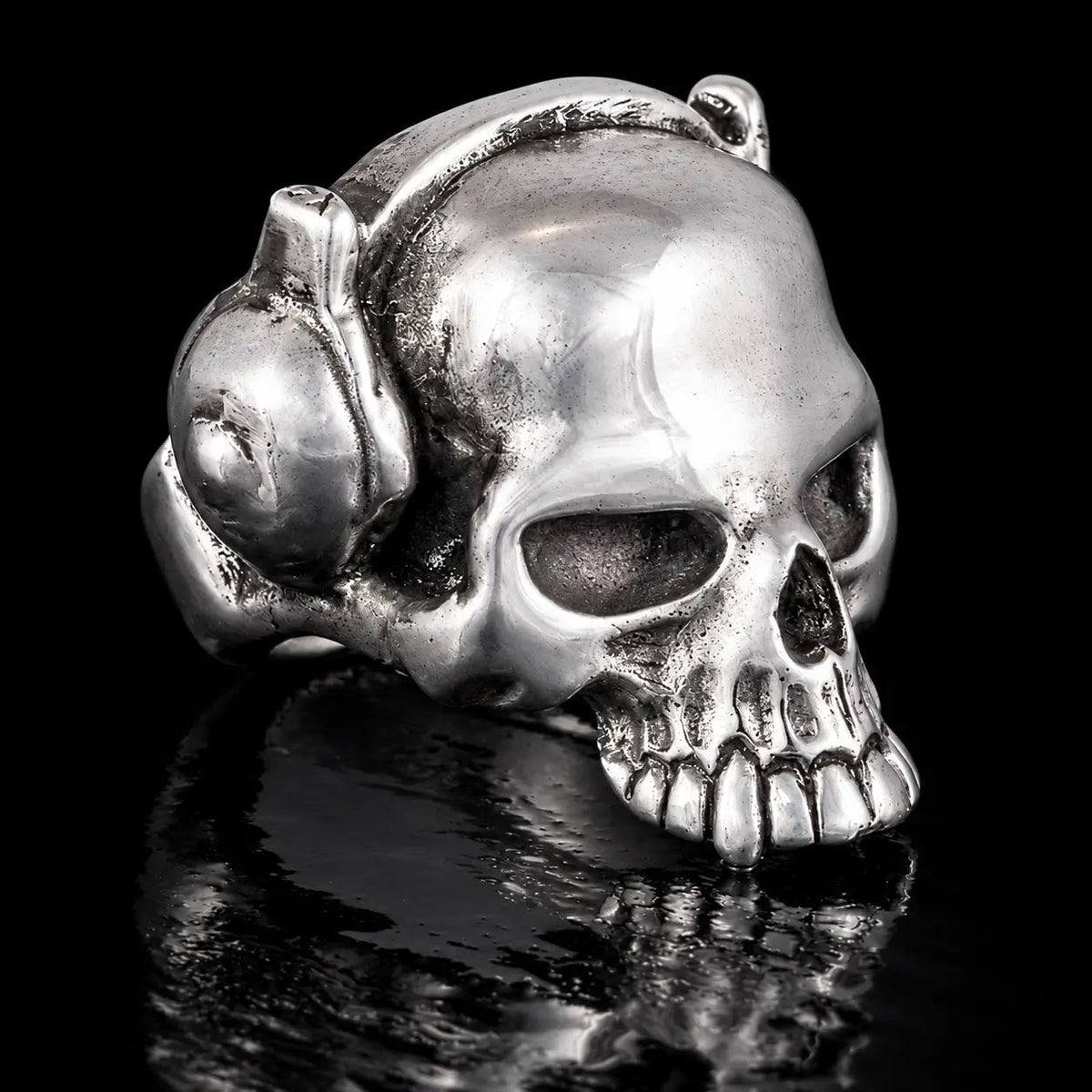 Evil Skull with headphones - Curiouser Collective